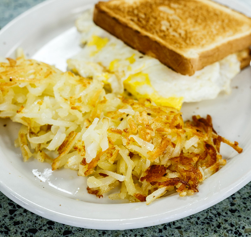 Fried egg sandwich with hash browns